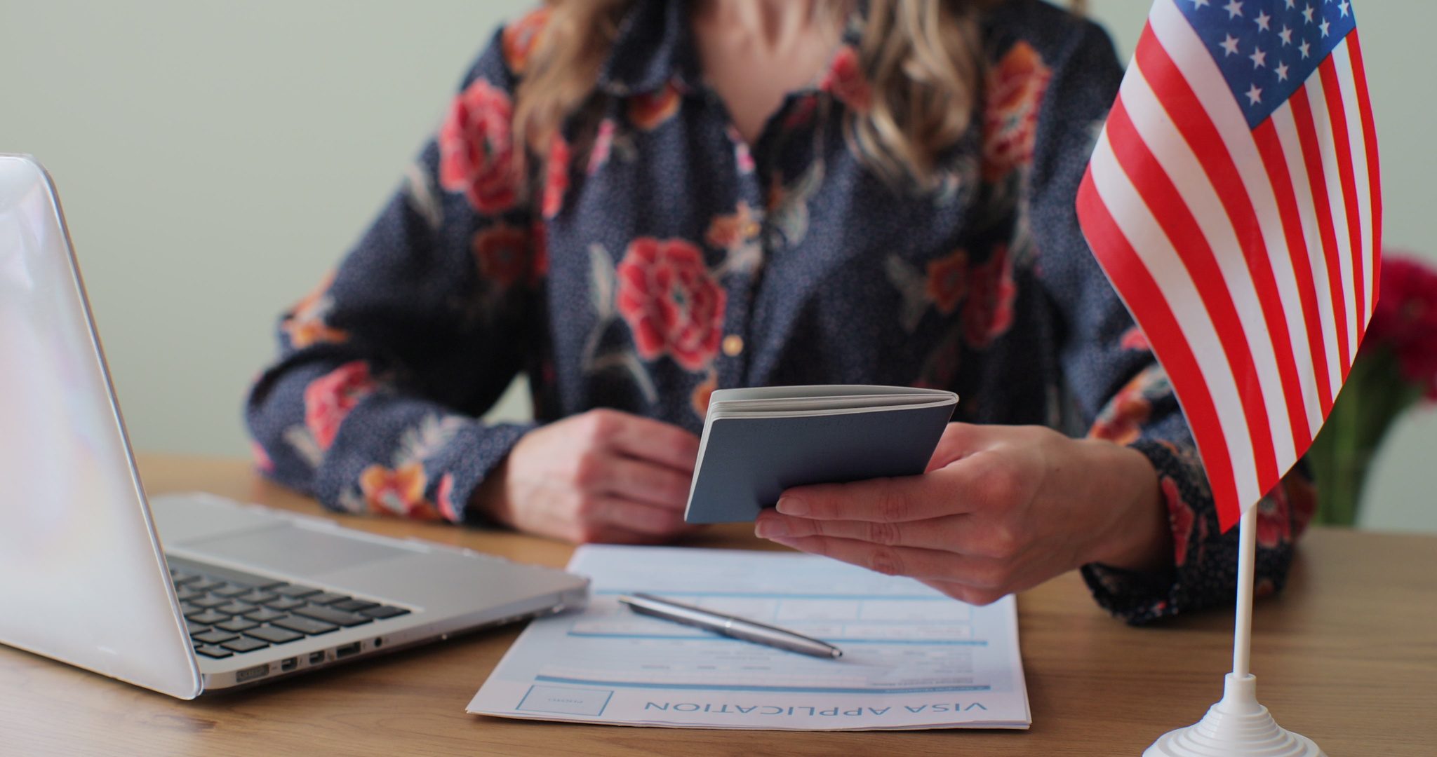 American woman consular officer giving passport to male immigrant, work visa, citizenship. Visa Application online form immigration concept. Visa approval.